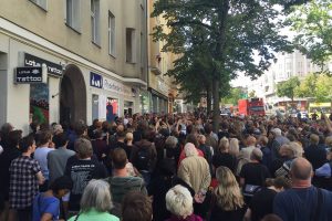 A crowd gathered outside where Bowie lived from 1976 to 1978 in Berlin