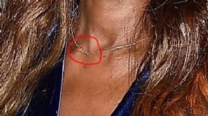 She wore a gold chain that read "David"